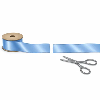 A ribbon shown in two pieces, with scissors nearby to show part was used.
