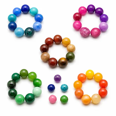 Five bead bracelets with nine beads each and five loose beads left over.