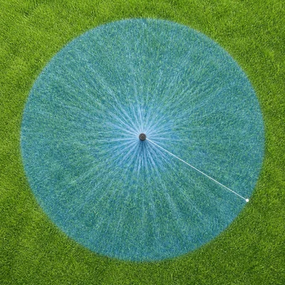 Sprinkler watering a circular area of grass with a radius shown.