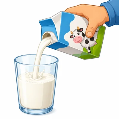 Milk being poured into a glass.