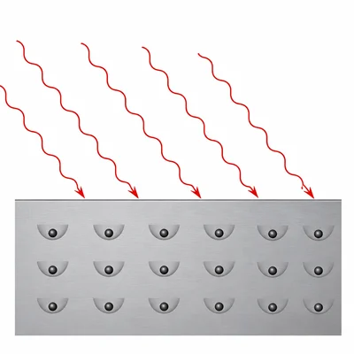 Many red low-frequency photons strike a metal surface, but electrons remain trapped and are not emitted.